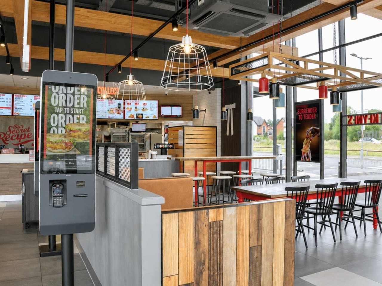 Inside one of our restaurants — order counter and menu boards